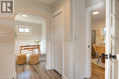 Wood-finish flooring throughout, complemented by wainscoting - 99 Shantz Lane, Kitchener, ON - Indoor Photo Showing Other Room