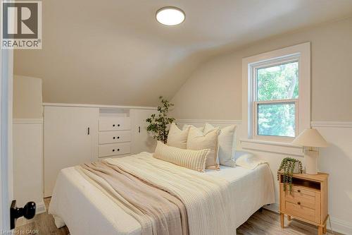 Sloped ceiling detail with recessed lighting, single window, and integrated built-in storage - 99 Shantz Lane, Kitchener, ON - Indoor Photo Showing Bedroom