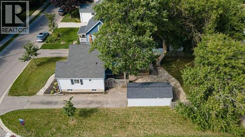 Single-story property with a gray shingle roof, light-colored siding, and a detached shed - 99 Shantz Lane, Kitchener, ON - Outdoor