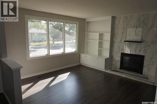 91 Plant Crescent, Regina, SK - Indoor With Fireplace