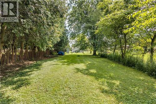 Expansive backyard with a manicured lawn, established trees. - 995 Mcdowell Road E, Simcoe, ON - Outdoor