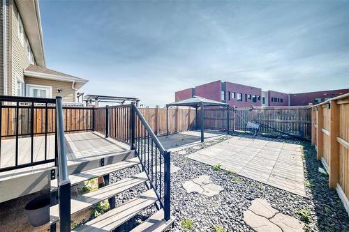 Tiled Landscaped Backyard with Gazebo - 147 Phoenix Way, Winnipeg, MB - Outdoor With Exterior
