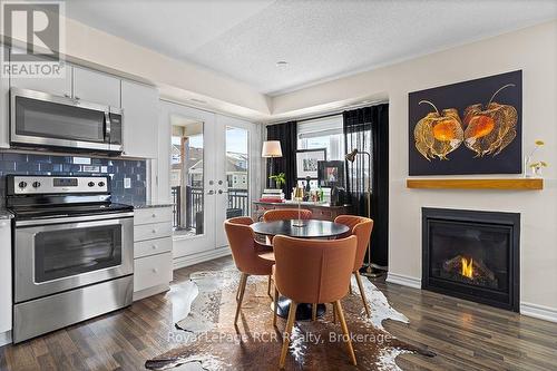 Staged Photo - Dining - #308 - 7 Anchorage Crescent, Collingwood, ON - Indoor With Fireplace