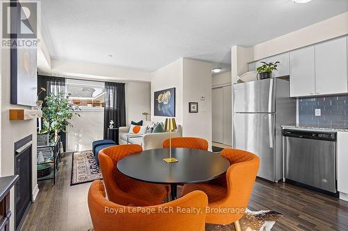 Staged Photo - Dining and Living Room - #308 - 7 Anchorage Crescent, Collingwood, ON - Indoor Photo Showing Kitchen With Stainless Steel Kitchen