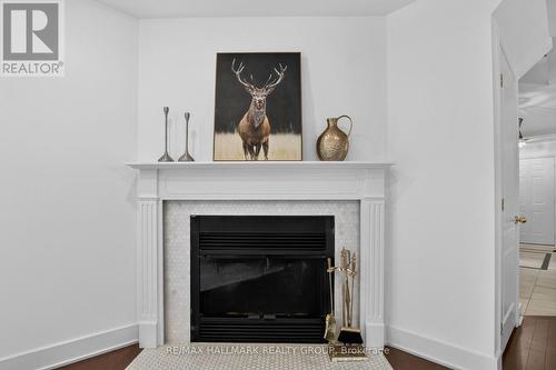 23 Whitegate Crescent, Ottawa, ON - Indoor Photo Showing Living Room With Fireplace