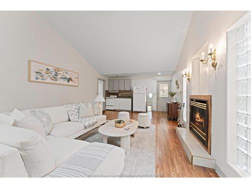 3740 Ouellette, Windsor, ON - Indoor Photo Showing Living Room With Fireplace