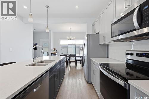 122 Taskamanwa Street, Saskatoon, SK - Indoor Photo Showing Kitchen With Double Sink