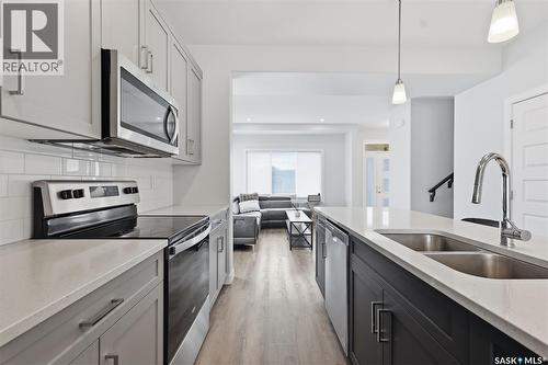 122 Taskamanwa Street, Saskatoon, SK - Indoor Photo Showing Kitchen With Double Sink With Upgraded Kitchen