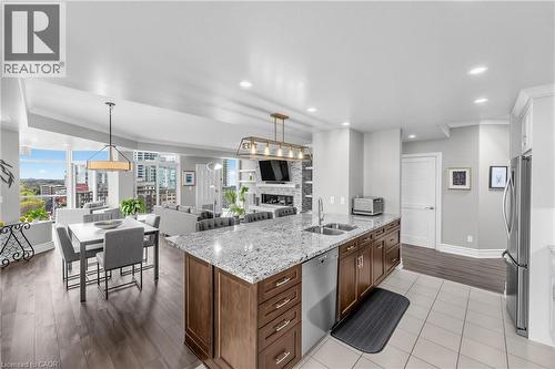 Kitchen island with granite countertop and double stainless steel sink - 1477 Lakeshore Road Unit# Ph 1, Burlington, ON 