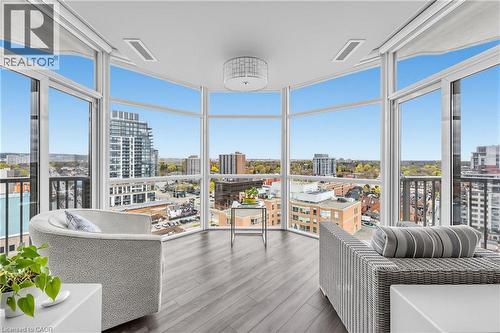 Expansive windows with city and tree-lined surroundings - 1477 Lakeshore Road Unit# Ph 1, Burlington, ON 