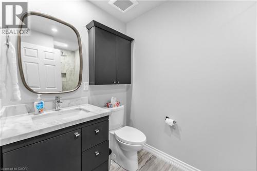 Vanity with a stone-finish countertop and an undermount sink - 1477 Lakeshore Road Unit# Ph 1, Burlington, ON 