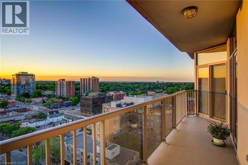 Expansive balcony featuring glass panel railings, a concrete floor, and direct access to interior spaces through a glass sliding door - 1477 Lakeshore Road Unit# Ph 1, Burlington, ON 