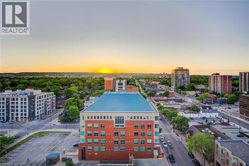 Aerial perspective showcasing a vibrant urban setting with extensive green spaces - 1477 Lakeshore Road Unit# Ph 1, Burlington, ON 