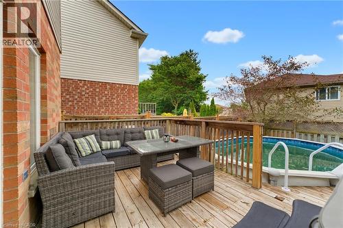 Expansive wood deck with a built-in above-ground pool and wood railing - 592 Little Dover Crescent, Waterloo, ON - Outdoor With Above Ground Pool With Deck Patio Veranda With Exterior