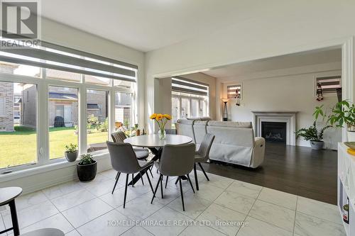 1429 Davis Loop, Innisfil, ON - Indoor Photo Showing Dining Room With Fireplace