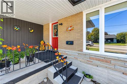 Brick exterior with a red entry door - 87 Bond Street, Kitchener, ON 