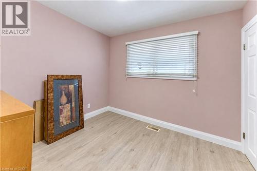 Pale pink walls with wood-finish flooring - 87 Bond Street, Kitchener, ON 