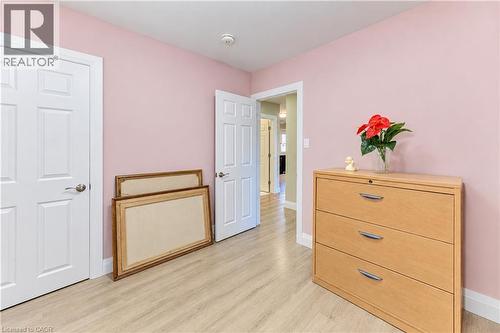 Light wood-finish flooring and white trim - 87 Bond Street, Kitchener, ON 