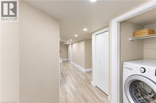 Recessed lighting, wood-finish flooring, and white trim throughout - 87 Bond Street, Kitchener, ON 