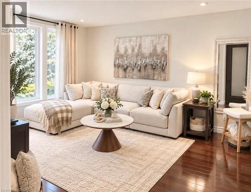 Hardwood flooring, recessed lighting, and large windows with natural light - 56 Windrush Trail, Kitchener, ON 