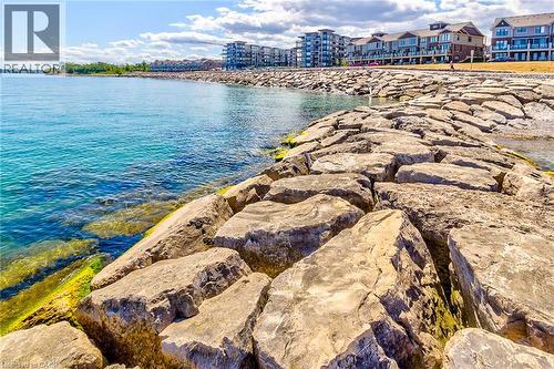 Waterfront residences featuring multiple stories and balconies - 65 Waterview Lane, Grimsby, ON 