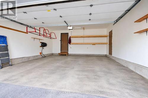 Double car garage with custom shelving. - 24 Tammela Court, Ottawa, ON 