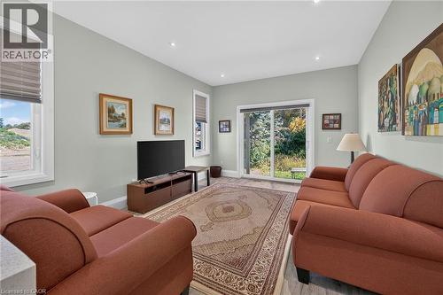 Recessed ceiling lighting, durable wood-finish flooring, and white trim windows with blinds - 41 Eleanor Avenue, Hamilton, ON 