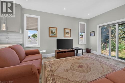 Recessed ceiling lighting, wood-finish flooring, light gray wall paint, and white trim - 41 Eleanor Avenue, Hamilton, ON 