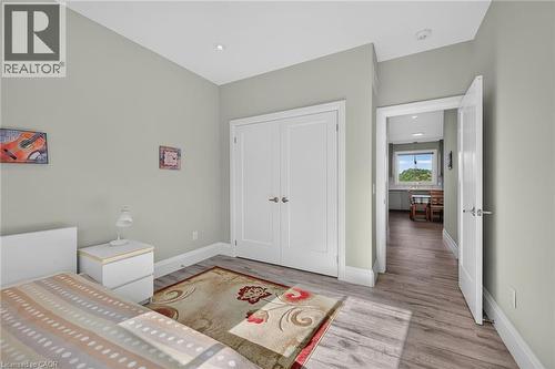 Wood-finish flooring, recessed lighting, and white interior doors - 41 Eleanor Avenue, Hamilton, ON 