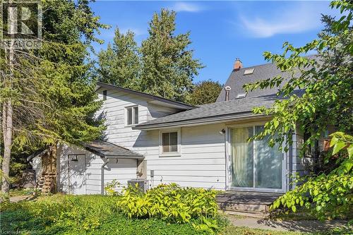 Sliding glass door access, exterior deck, multiple skylights, and a chimney feature - 12 Hill Street, Kitchener, ON 