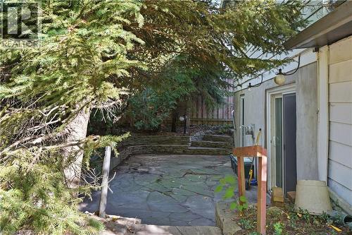 Flagstone patio with a multi-level design and retaining walls - 12 Hill Street, Kitchener, ON 