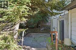 Flagstone patio with a multi-level design and retaining walls - 
