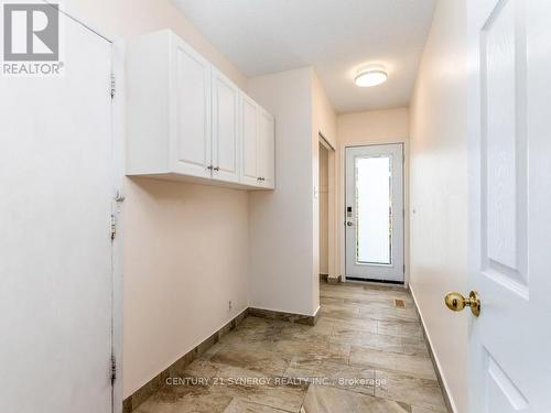 Back hall foyer w/side door,closet, garage access. - 2298 Bowman Road, Ottawa, ON 