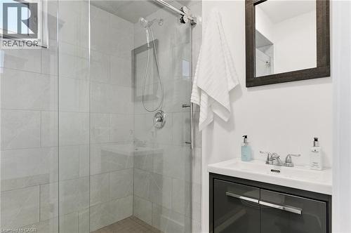 Walk-in shower with clear glass enclosure and tile surround - 164 Wilson Street, Hamilton, ON 