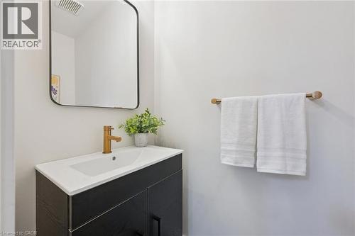 Integrated vanity with a white countertop and rectangular undermount sink - 6 Branwood Place, Kitchener, ON 