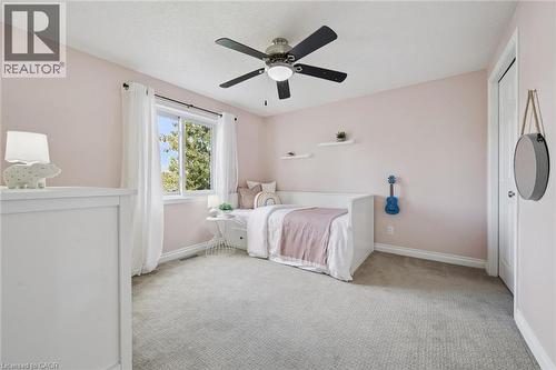 Second bedroom with window and light-toned carpet - 6 Branwood Place, Kitchener, ON 