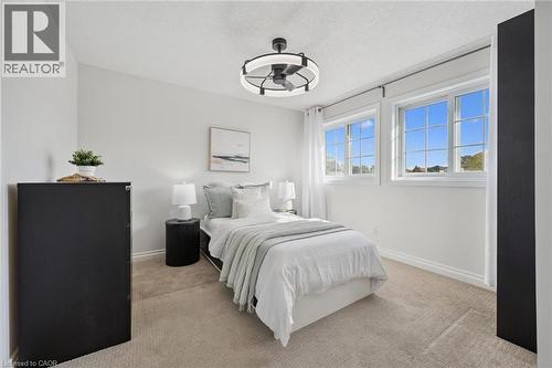 Third bedroom with two windows and light-toned carpet - 6 Branwood Place, Kitchener, ON 