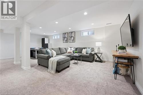 Finished lower level with recessed lighting, light-toned carpeting - 6 Branwood Place, Kitchener, ON 