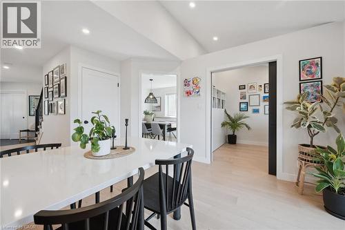 Crisp white walls, light wood-finish flooring, recessed lighting, and a white countertop - 6 Branwood Place, Kitchener, ON 