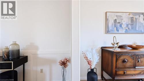 Interior wall featuring custom white wainscoting and smooth neutral-toned wall finish - 488 Heather Hill Place, Waterloo, ON 