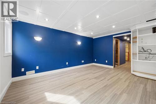 Coffered ceiling with integrated recessed lighting, wood-finish flooring, and built-in shelving unit - 83 Glazebrook Crescent, Cambridge, ON 
