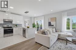 Kitchen featuring high-gloss white cabinetry, stainless steel appliances, a multi-tonal tile backsplash, and a central island with a quartz countertop, complemented by wood-finish flooring and recesse - 