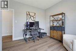 Neutral wall tones paired with wood-finish flooring - 