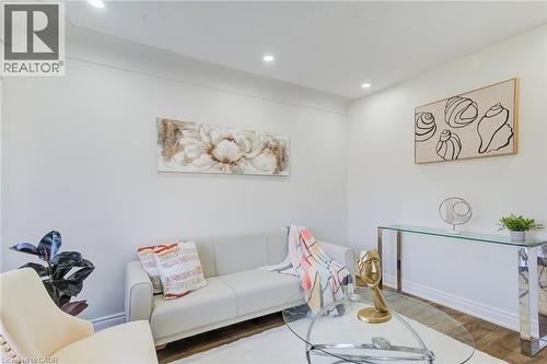 Neutral-toned walls, wood-finish flooring, and recessed ceiling lighting - 46 Traynor Avenue, Kitchener, ON 