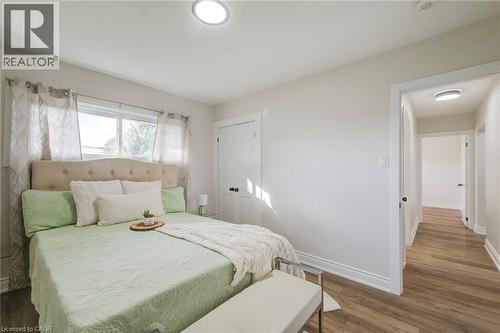 Neutral wall palette, wood-finish flooring, recessed ceiling lighting, and double-panel interior closet doors - 46 Traynor Avenue, Kitchener, ON 