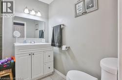 White vanity with a single basin sink, chrome faucet, and integrated countertop - 