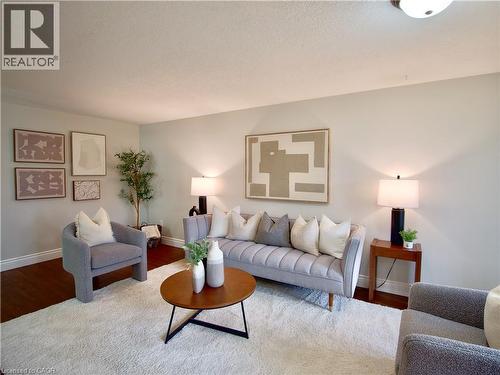 Interior room featuring neutral-toned walls and wood-finish flooring - 449 Exmoor Street, Waterloo, ON 