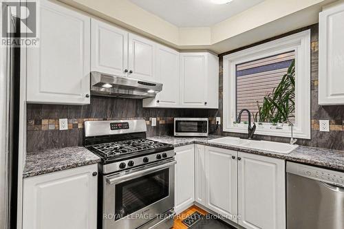Open Kitchen with ss appliances and island - 4 Degas Court, Ottawa, ON 