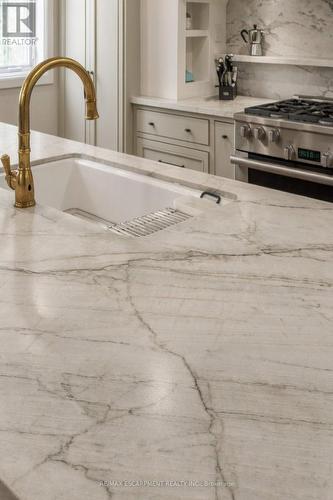 Quartzite counters. Perrin and Rowe brass faucets. - 890 Forest Glen Avenue, Burlington, ON 