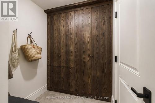 Family foyer from garage w/ custom built-ins. - 890 Forest Glen Avenue, Burlington, ON 